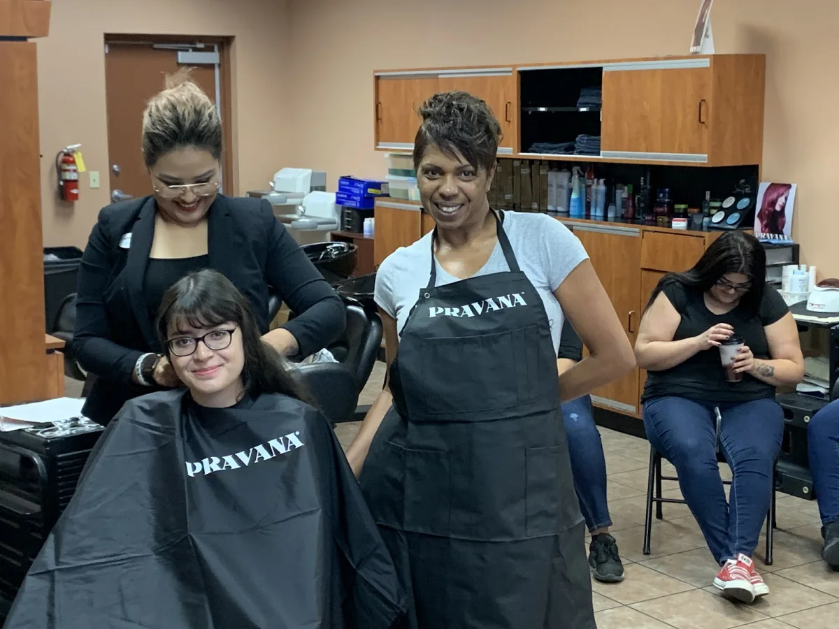 Yes We Do salon team with a client at the Resler location